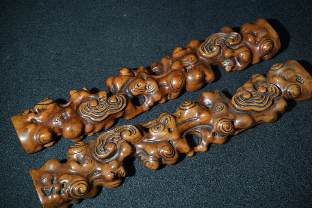 A pair of rosewood carved Ruyi weighing scales