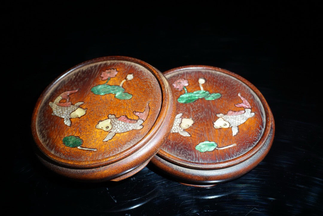 A pair of rosewood inlaid shells with a surplus base for years