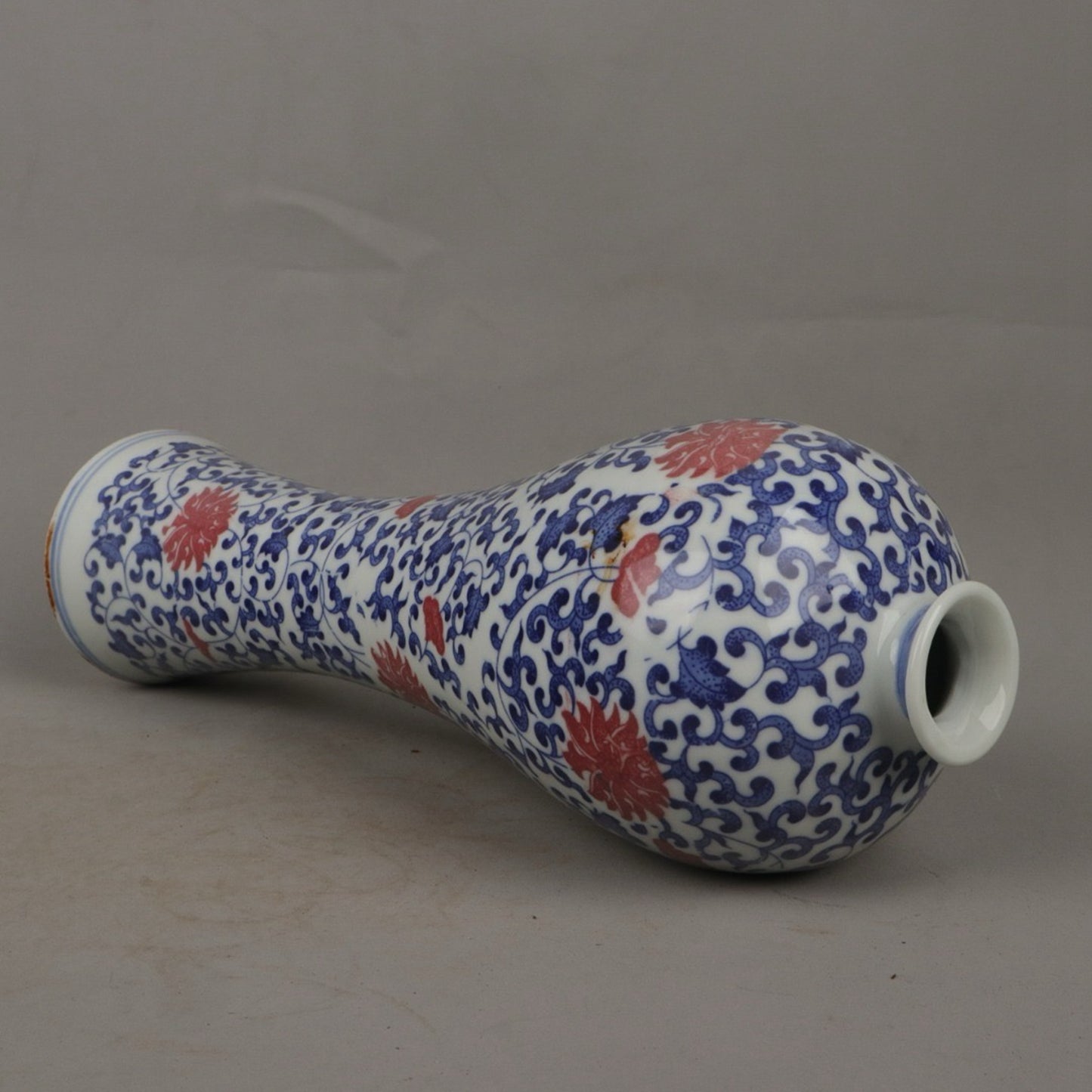 A pair of ceramic blue and white glazed plum blossom vases