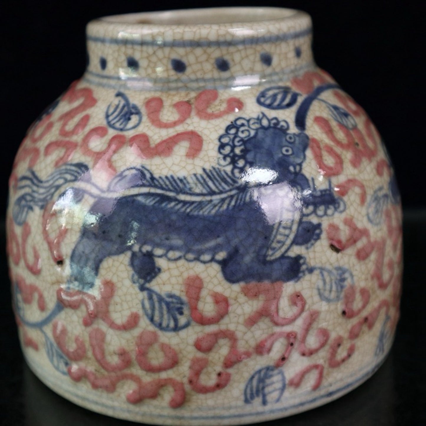 Ceramic blue and white glazed red lion patterned jar