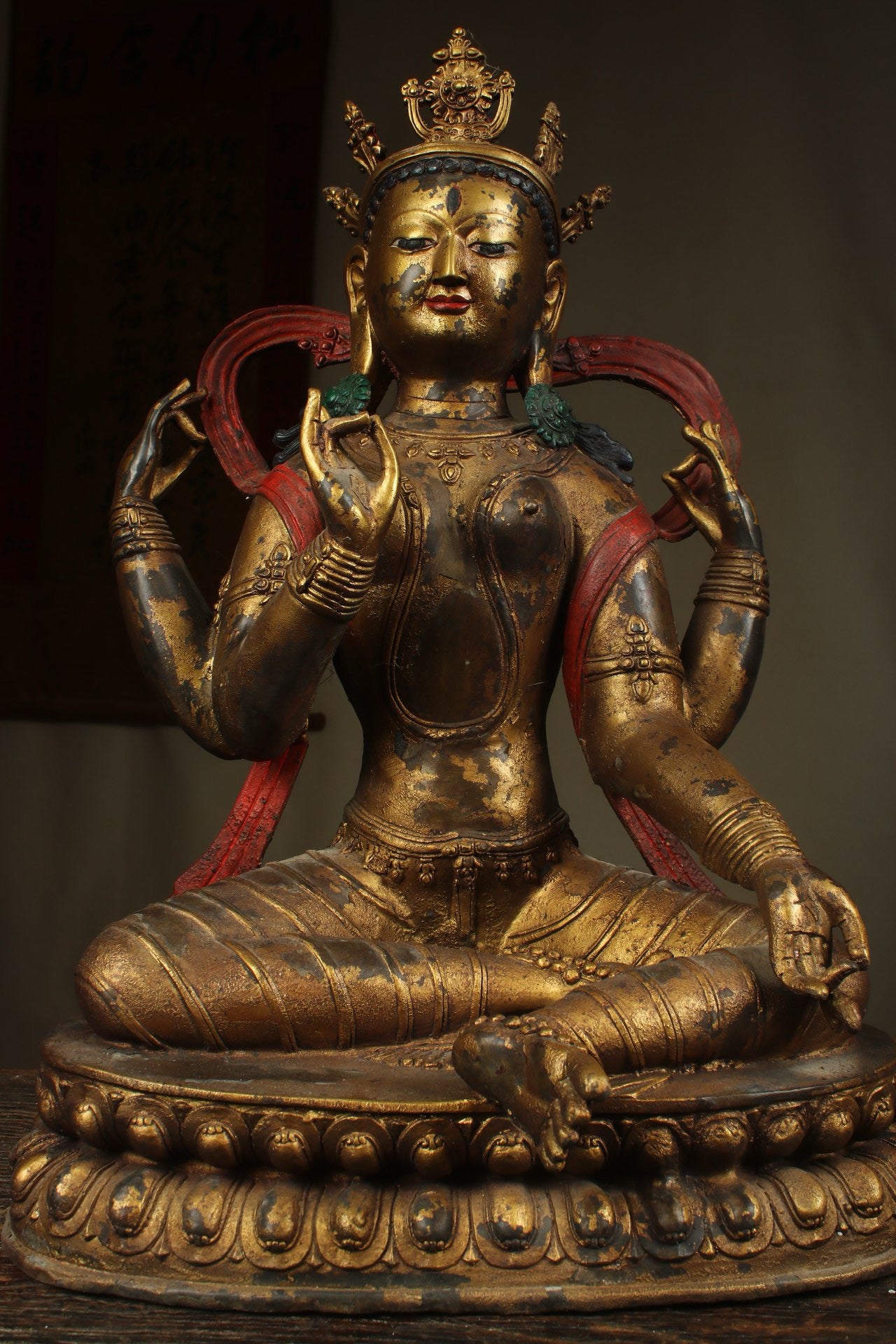 Handcrafted copper gilded Guanyin statue with four arms