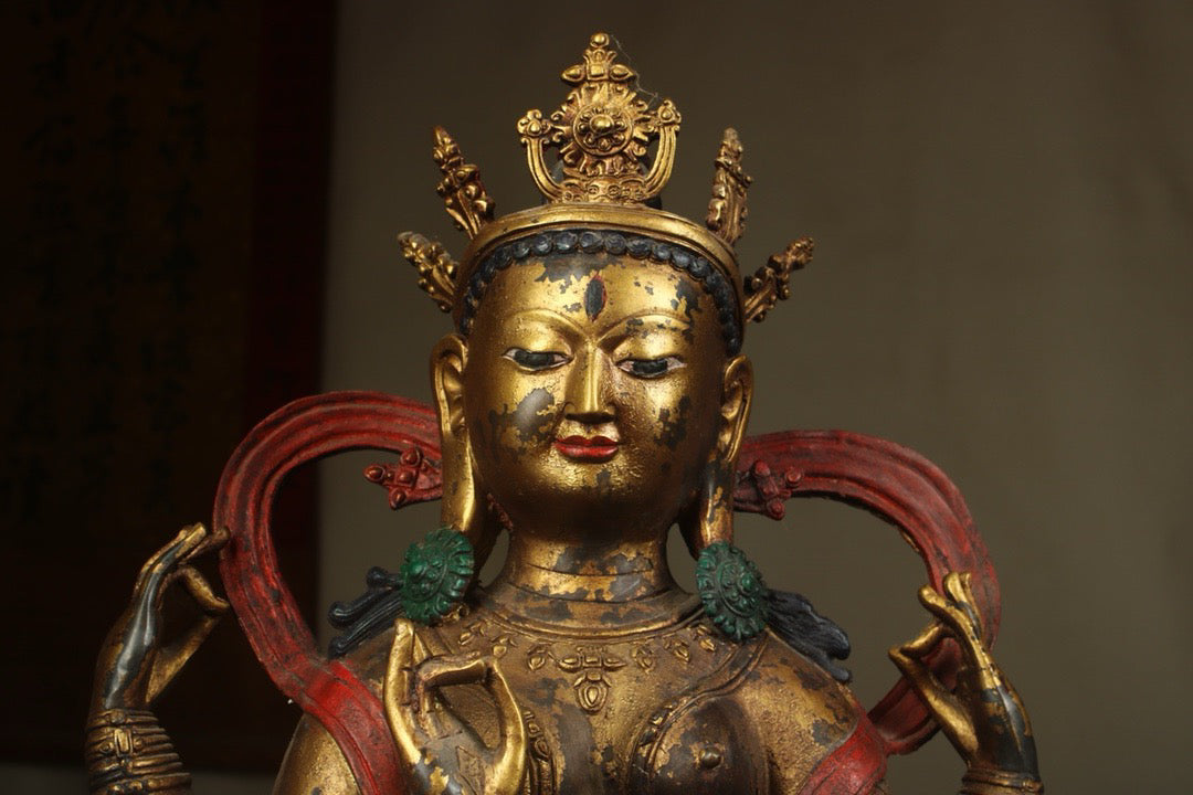Handcrafted copper gilded Guanyin statue with four arms