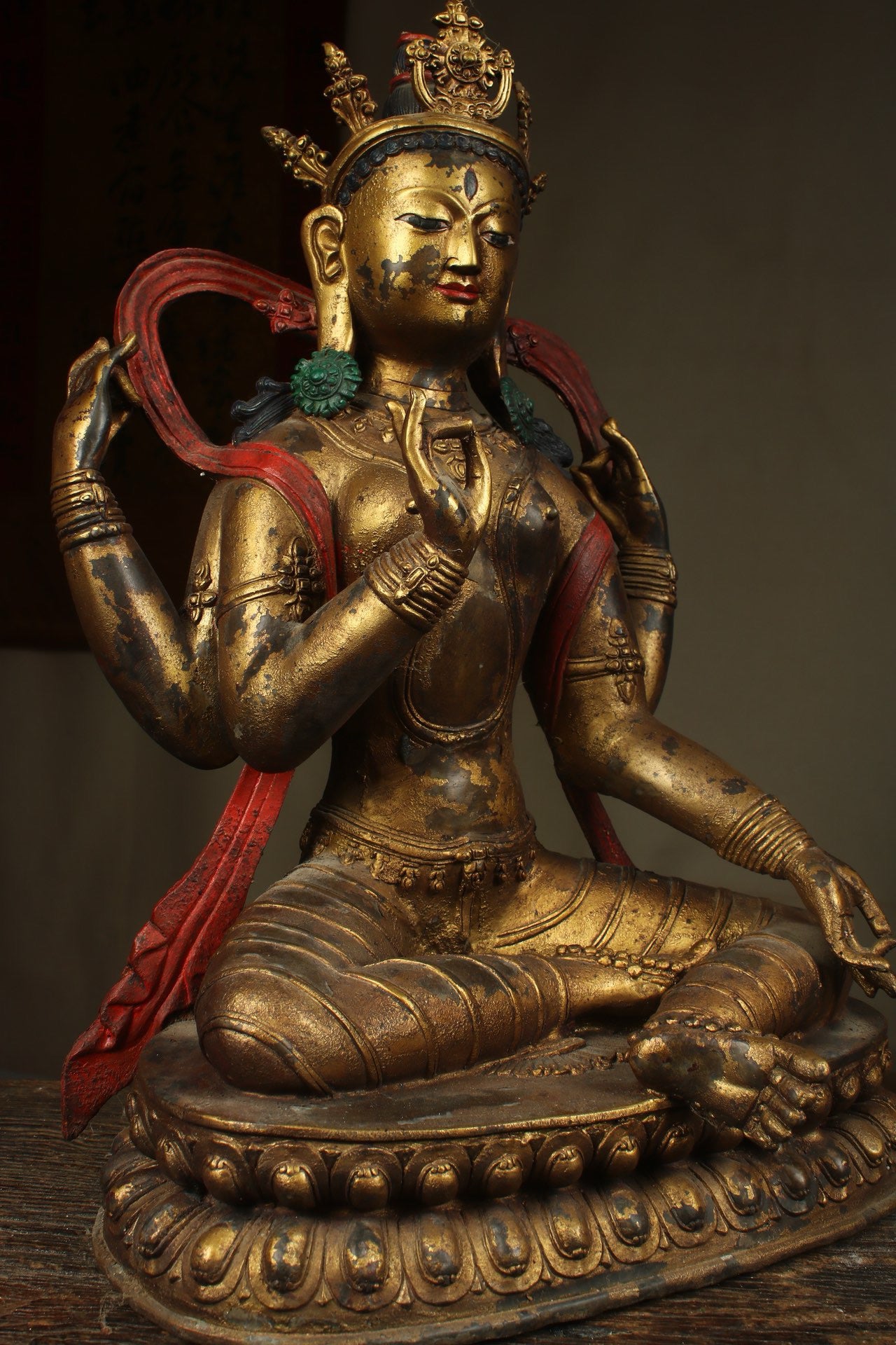 Handcrafted copper gilded Guanyin statue with four arms
