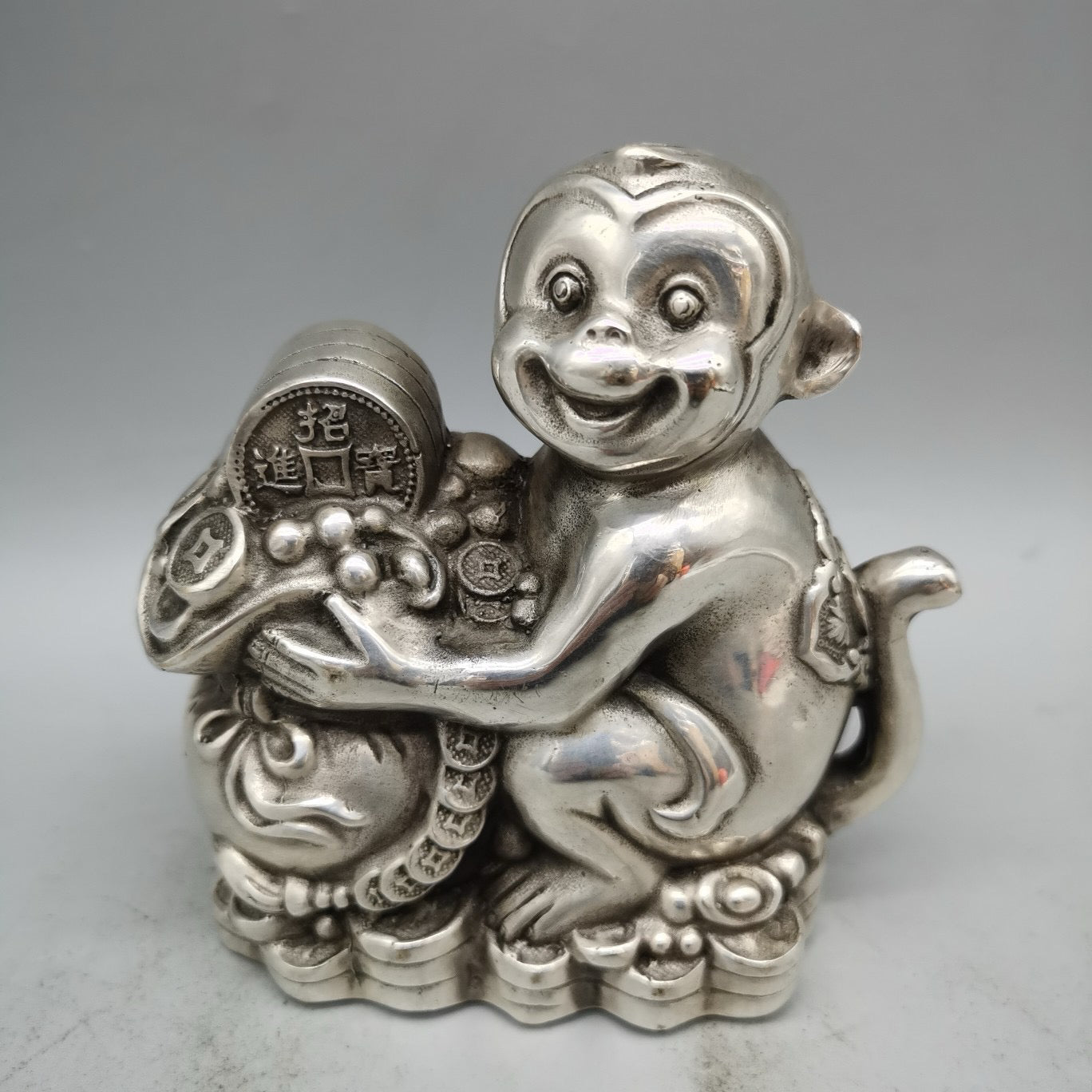 White copper monkey ornament