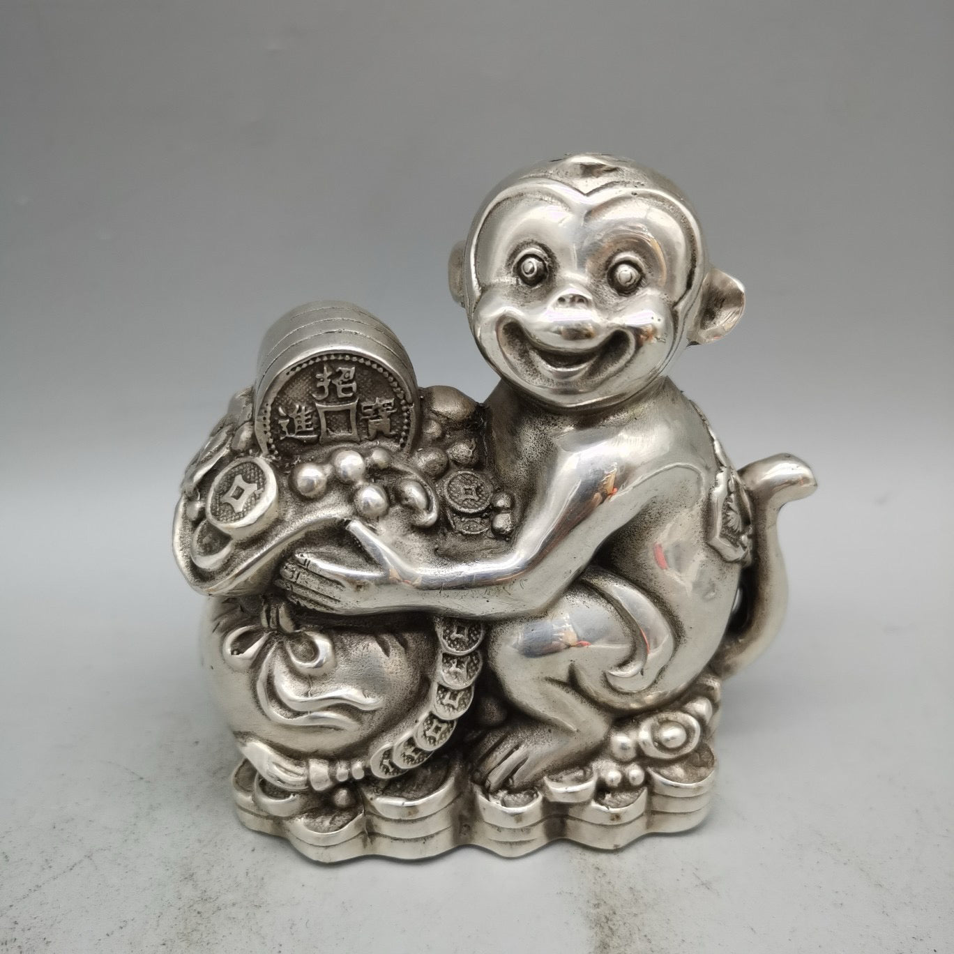 White copper monkey ornament