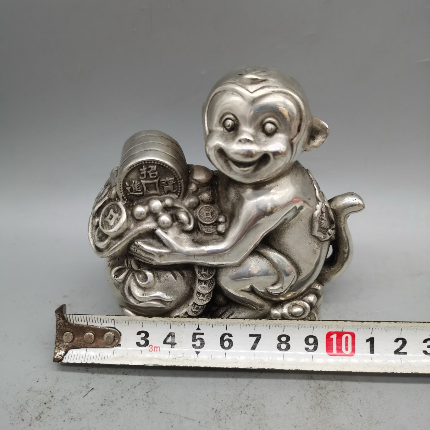 White copper monkey ornament