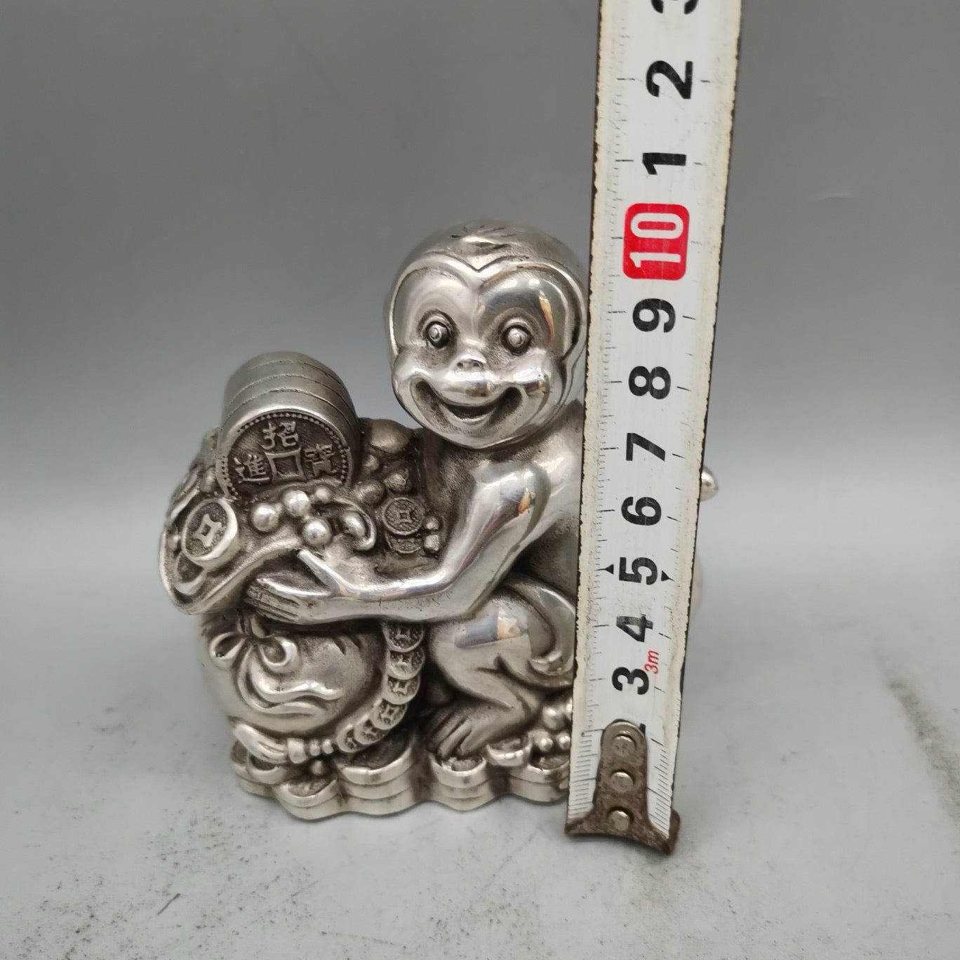 White copper monkey ornament