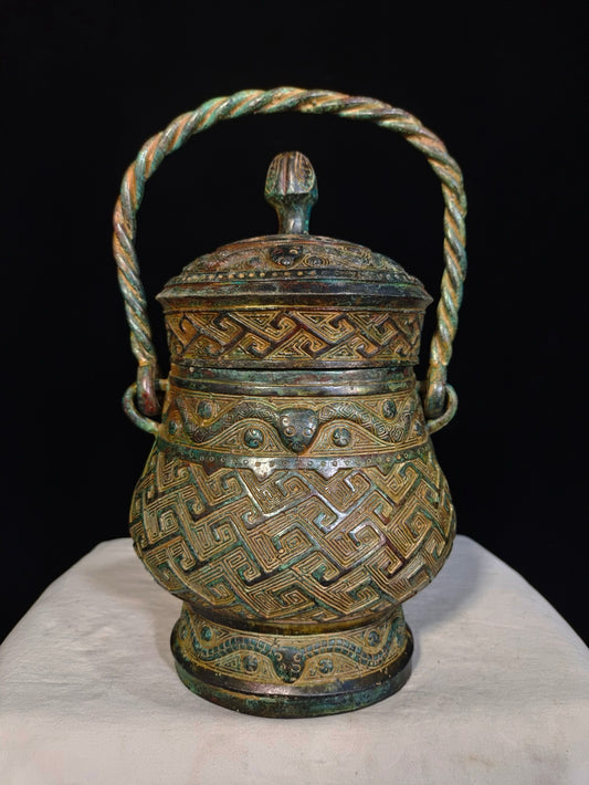 Bronze vessels with curved patterns and lifting beams