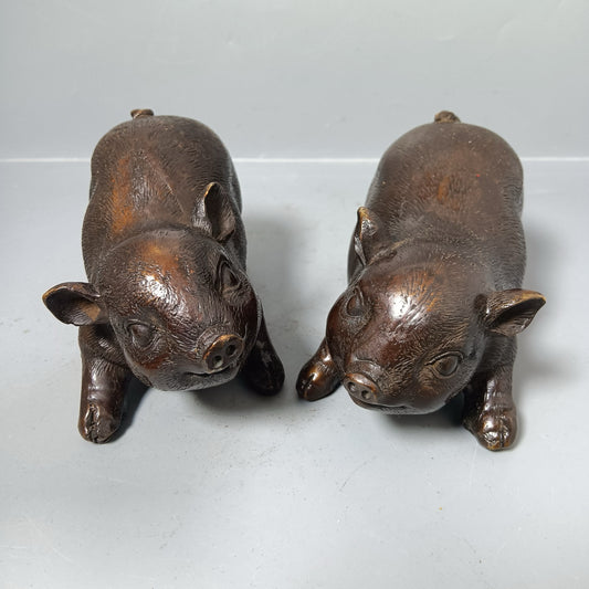 A pair of Chinese antique pure copper pigs