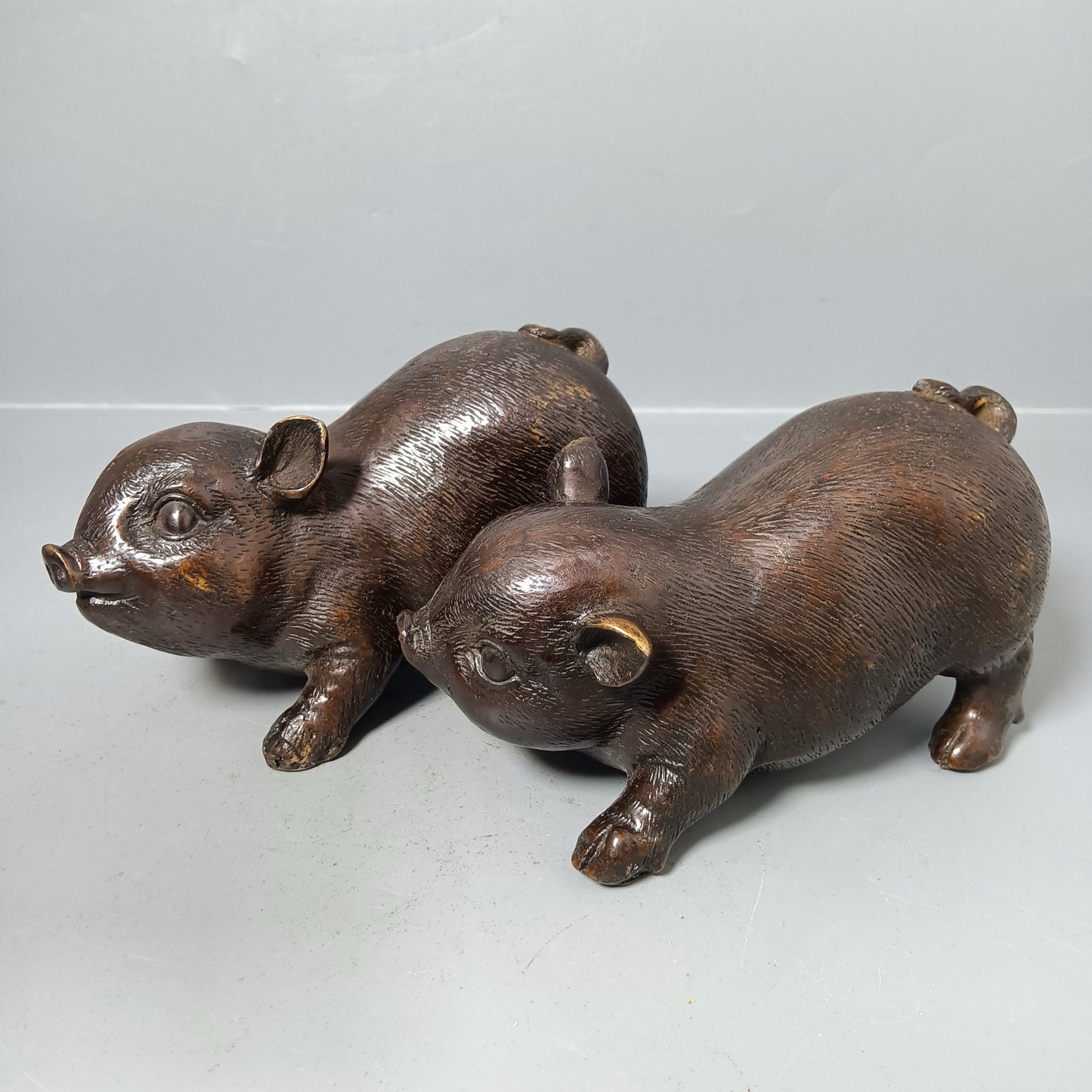 A pair of Chinese antique pure copper pigs