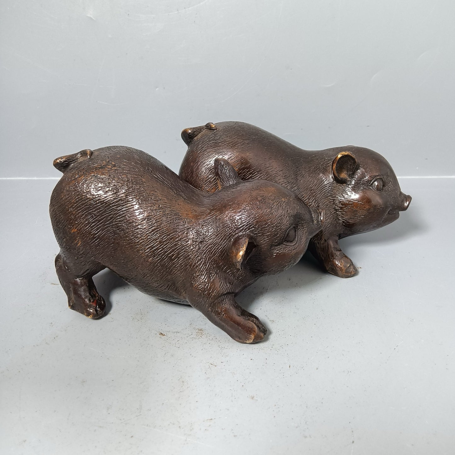 A pair of Chinese antique pure copper pigs