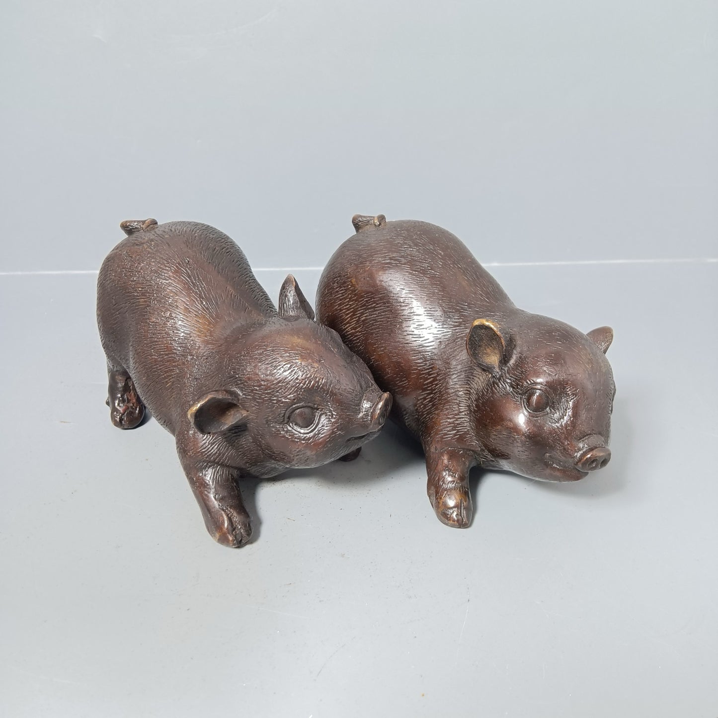 A pair of Chinese antique pure copper pigs