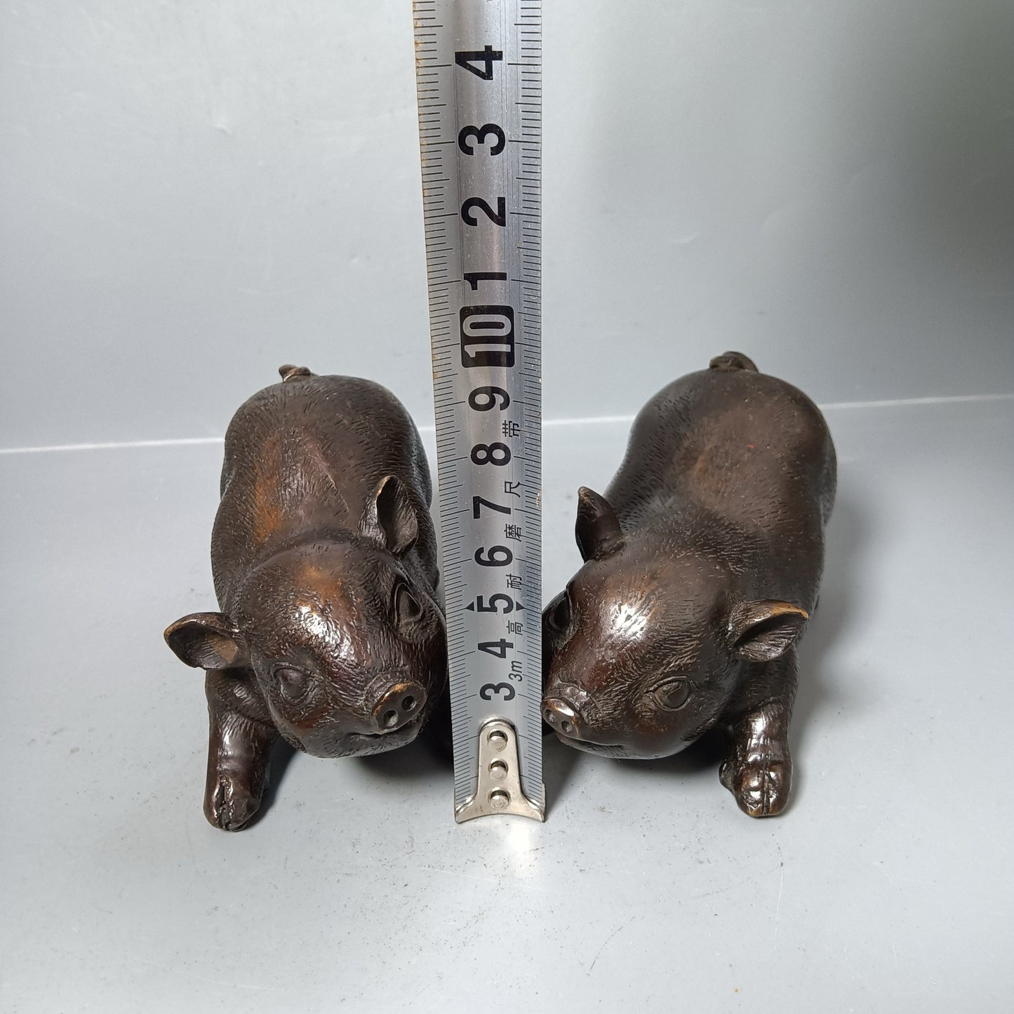 A pair of Chinese antique pure copper pigs