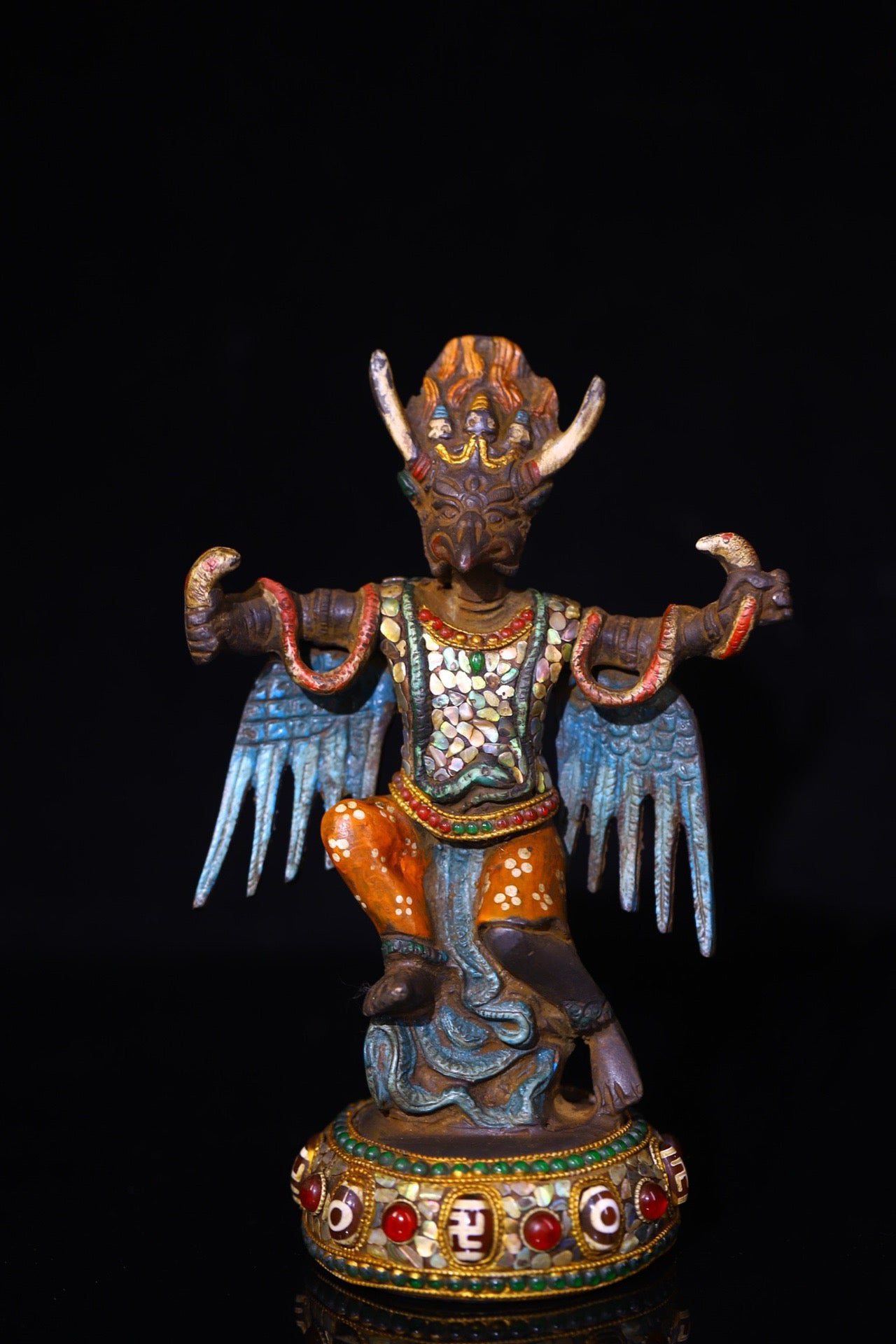 Copper handmade hammering, chiseling and depicting the colorful Dapeng Golden Winged Bird