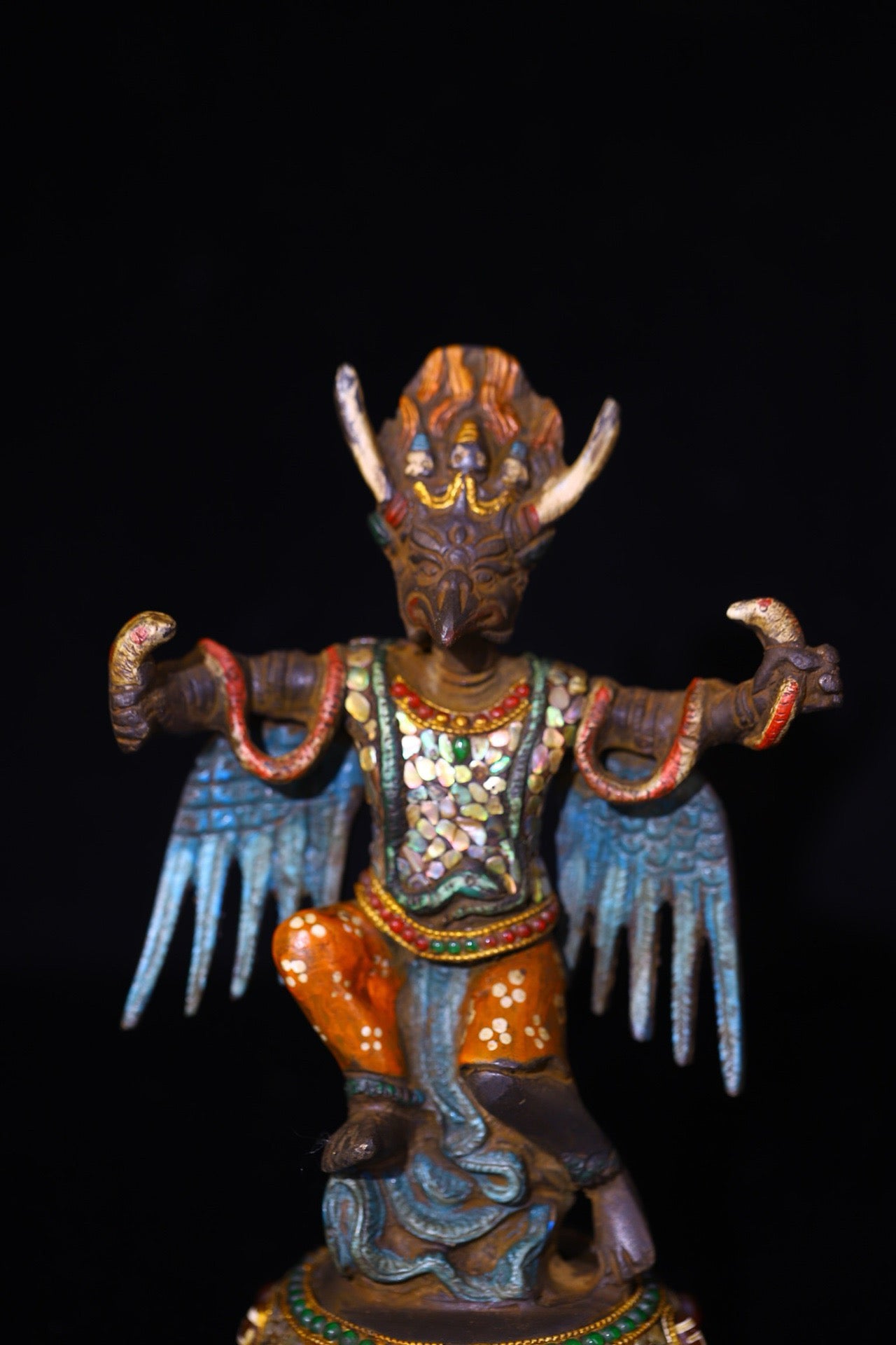 Copper handmade hammering, chiseling and depicting the colorful Dapeng Golden Winged Bird