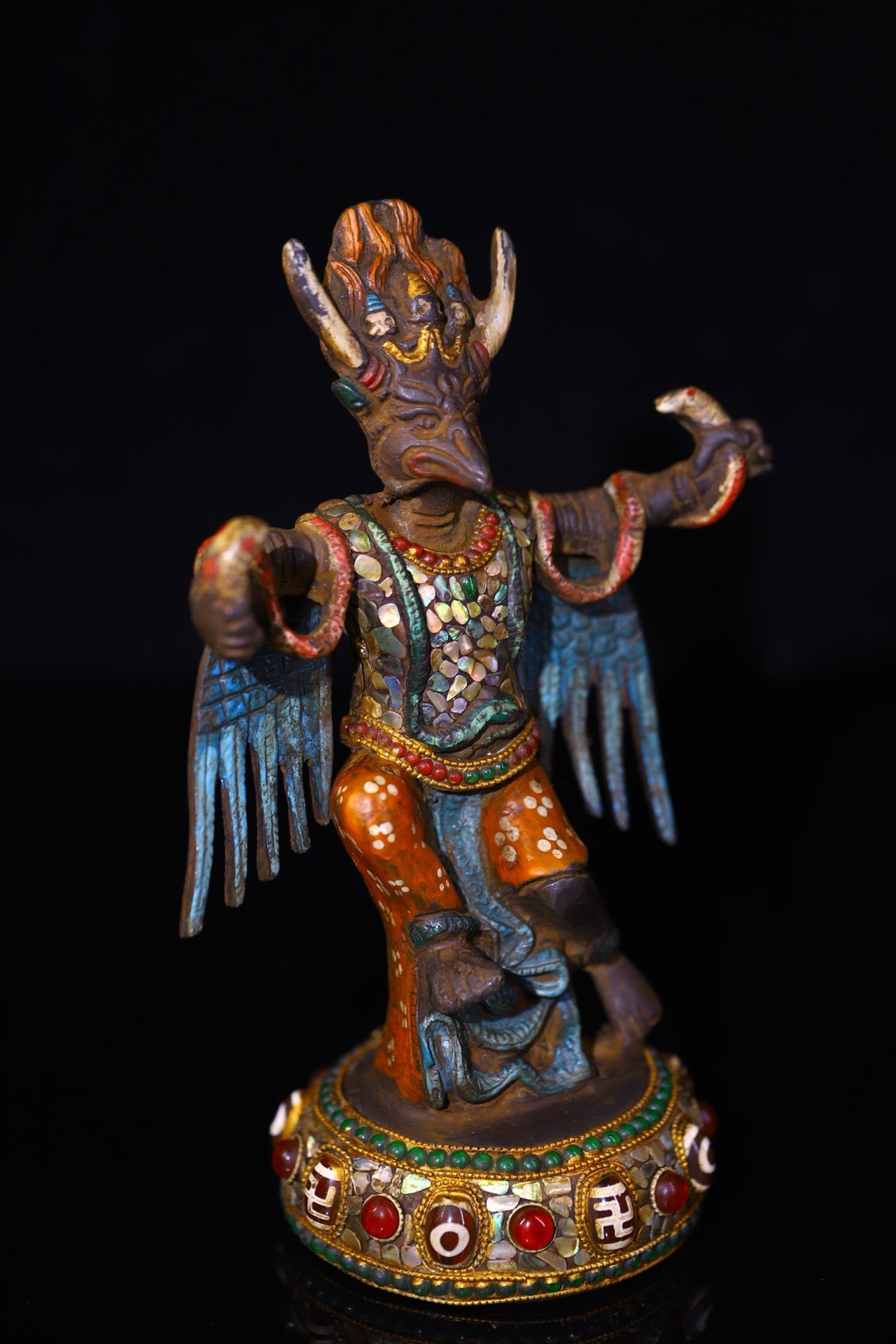Copper handmade hammering, chiseling and depicting the colorful Dapeng Golden Winged Bird