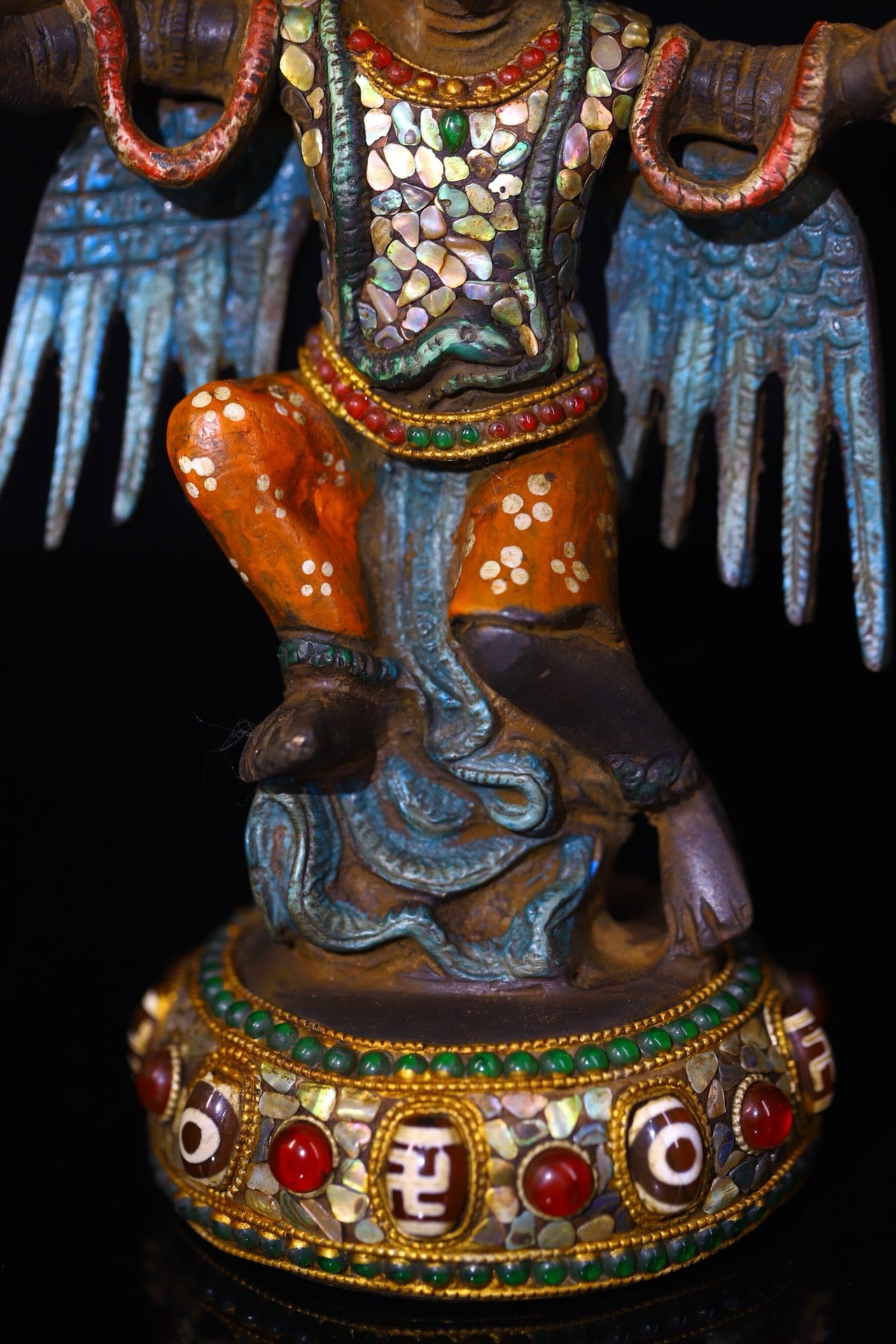 Copper handmade hammering, chiseling and depicting the colorful Dapeng Golden Winged Bird