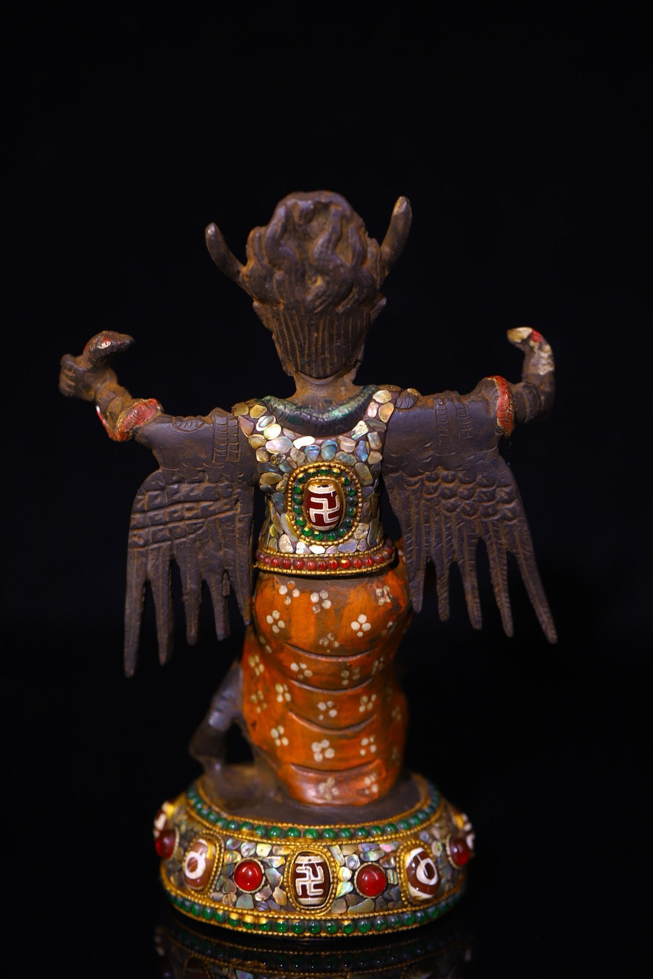Copper handmade hammering, chiseling and depicting the colorful Dapeng Golden Winged Bird