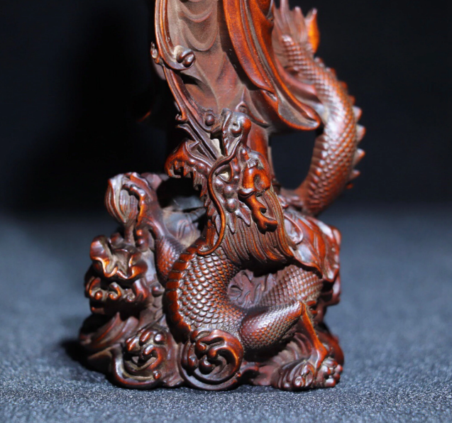Collection of antique Chinese boxwood dragon Guanyin statues