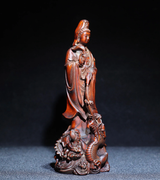 Collection of antique Chinese boxwood dragon Guanyin statues