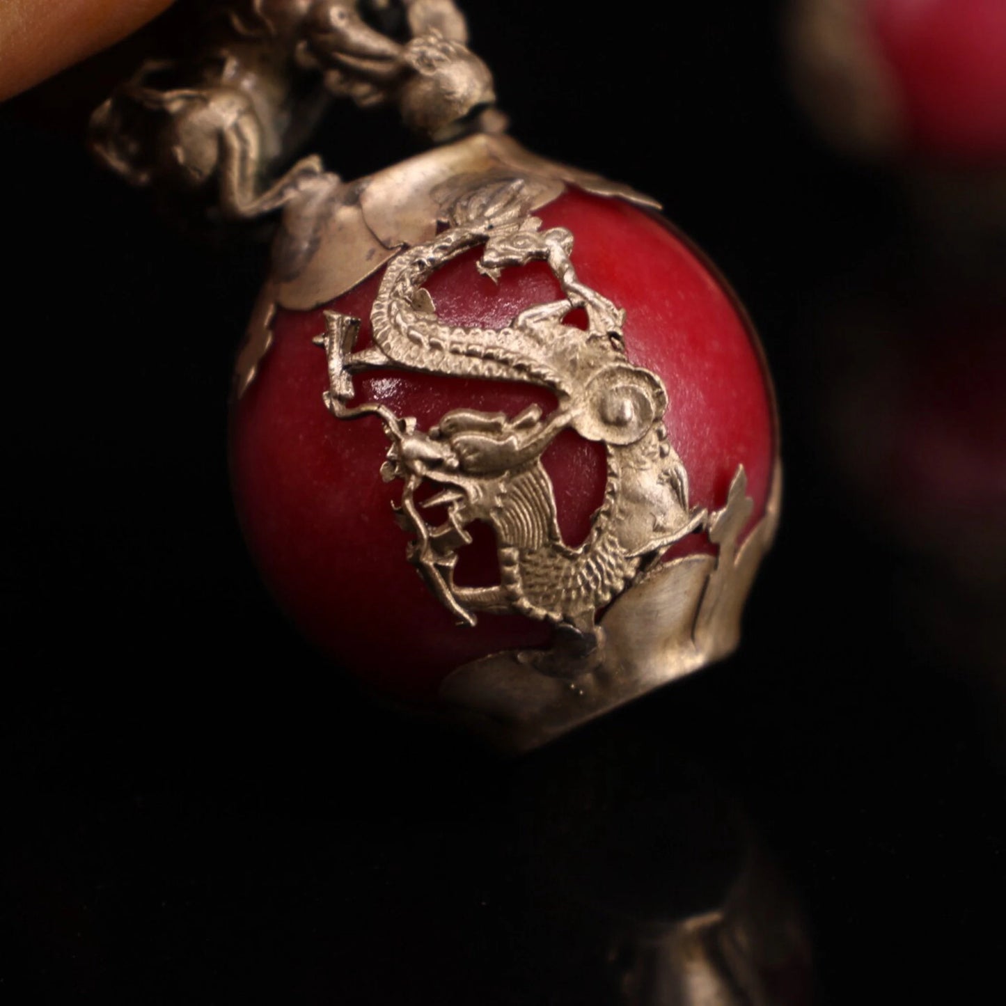 Collection of Chinese antique hand-carved Tibetan silver inlaid jade lion ball